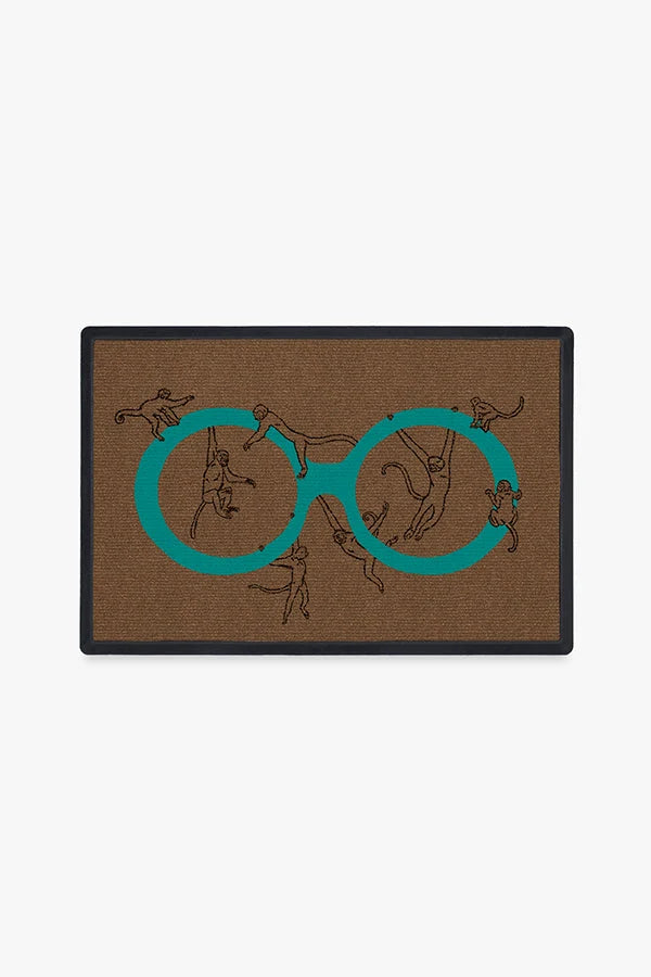 Monkey See Monkey Do Turquoise Doormat by Iris Apfel